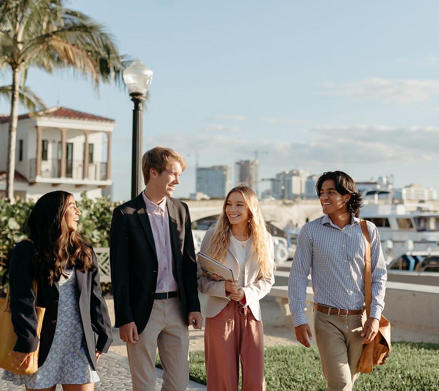 master of business administration mba students walk near the intercoastal waterway in West Palm Beach.